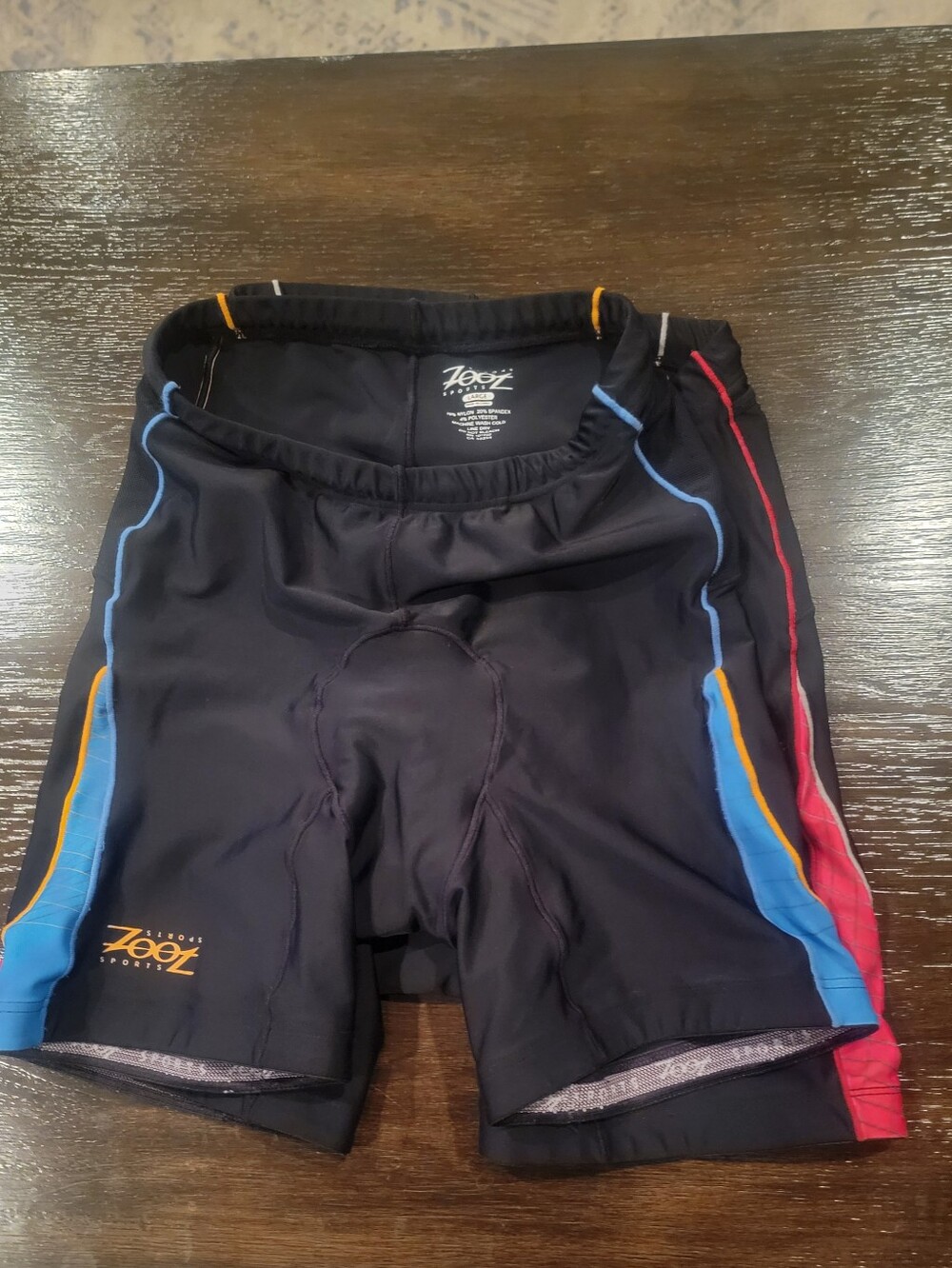 Zoot Black Cycling Shorts with Blue, Orange & Red Accents
